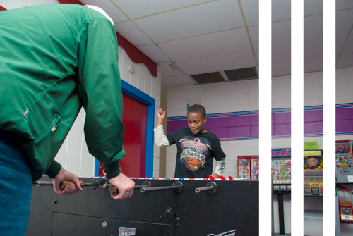 Big Brother and Little Brother play foosball