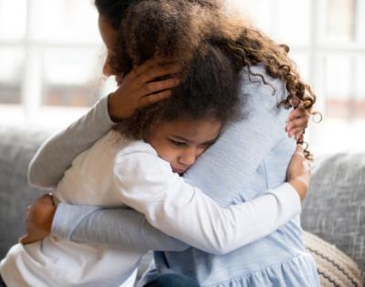 kid hugging parent