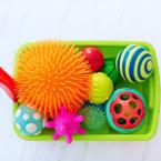 sensory bin with colorful toys