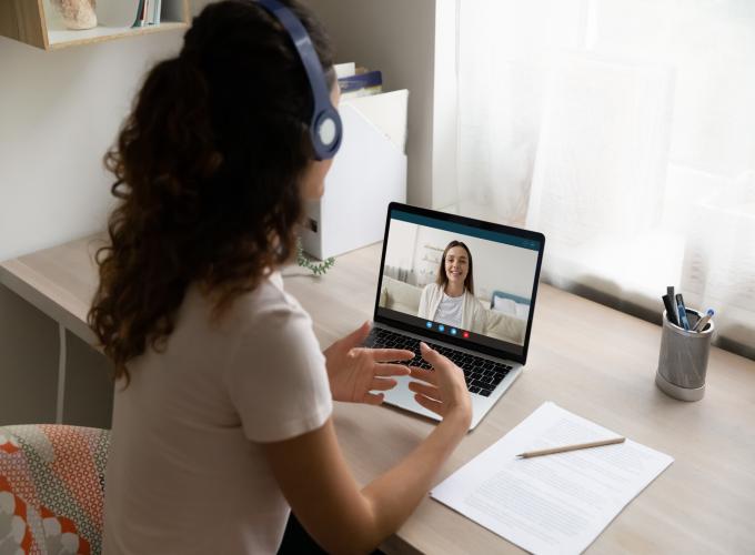 Women with headphones on tuning into therapy